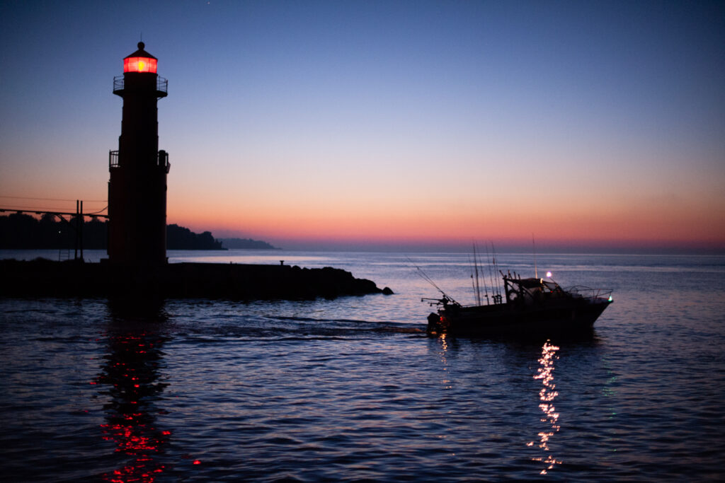 Lake Michigan fishermen leaving the harbor before sunrise; Algoma, WI 2010; © 2022 Jason Houge, All Rights Reserved; Algoma_042