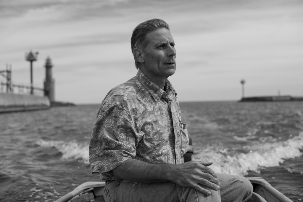 My stepdad, Pete, and I returning to the harbor after fishing on Lake Michigan in a jon boat; Algoma, W, 2010; © 2022 Jason Houge, All Rights Reserved; Algoma_051