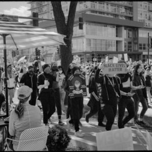 Black Lives Matter march passing a dining couple; Madison, WI 2020; © 2022 Jason Houge, All Rights Reserved; In_The_Air_Tonight_018