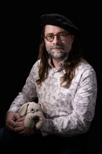Self Portrait holding Pound Puppy, 2026
